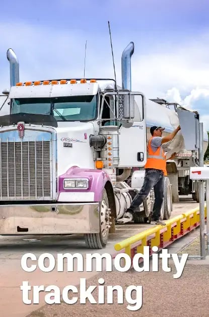 A big rig driver weighing on a scale to track commodities